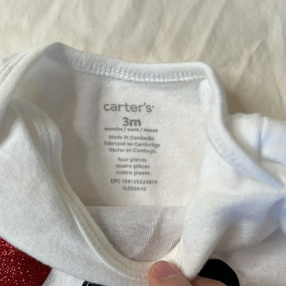Carter’s baby girl Christmas bundle. One pair of fleece footed pajamas, one tutu